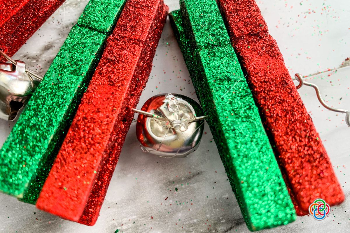 Clothespins and bells on a Christmas craft