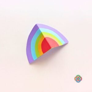 Fold Rainbow in half for Pop Up Rainbow Card Craft | Irish American Mom Layered paper rainbow folded in half to create a 3D effect for a Saint Patrick's Day pop up card craft.