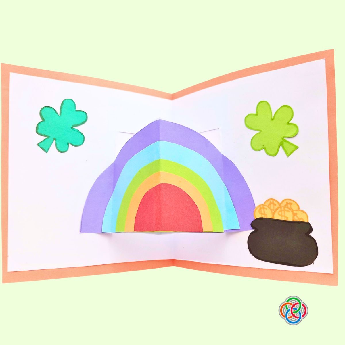 Glue the cover with the card for Pop Up Rainbow Card Craft | Irish American Mom