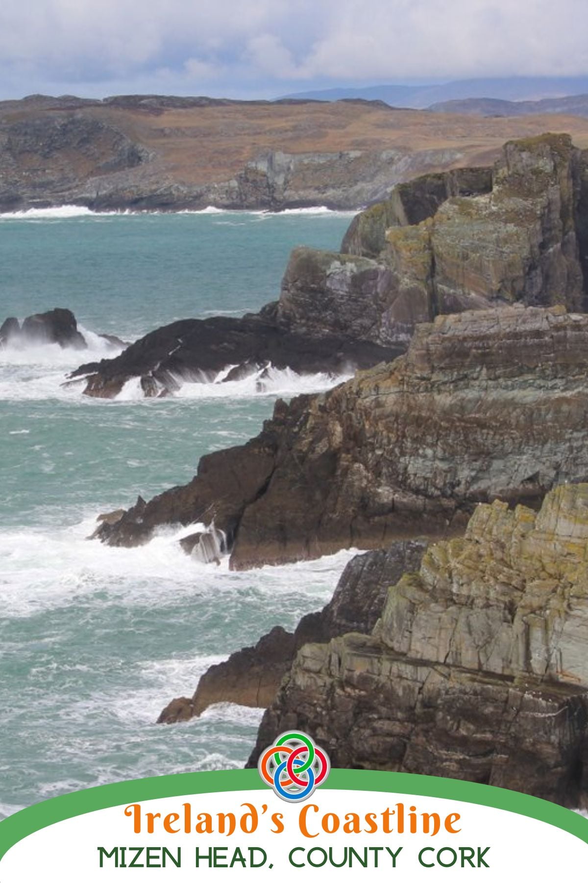 Rugged sea cliffs at Mizen Head in County Cork, Ireland, with turquoise Atlantic waves crashing against layered rock formations under a cloudy sky.