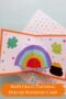 Pinterest graphic titled “Irish Craft Tutorial Pop-up Rainbow Card” featuring a handmade Saint Patrick’s Day card with a 3D rainbow, shamrocks, and a pot of gold.