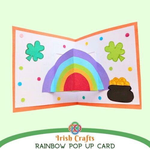 Open handmade St. Patrick's Day rainbow pop up card with shamrocks, colorful polka dots, and a pot of gold, labeled 