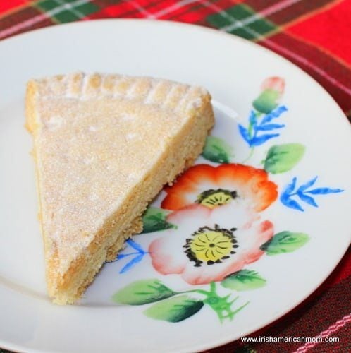 Traditional Irish shortbread wedges arranged on a plate with golden buttery texture.