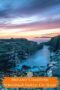 Streedagh Gully on the rugged coastline of County Sligo, Ireland, with calm ocean water flowing between rocky cliffs under a colorful sunset sky.