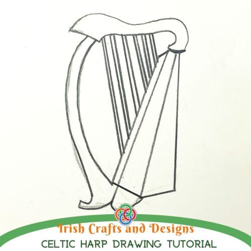 Pencil sketch of a traditional Celtic harp with curved frame and vertical strings on white paper, with text reading 