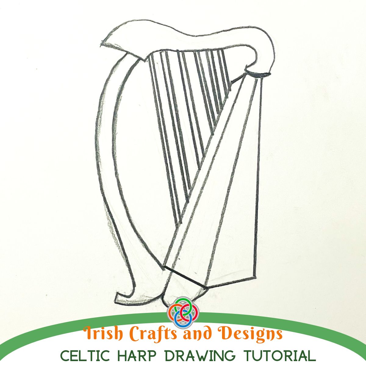 Pencil sketch of a traditional Celtic harp with curved frame and vertical strings on white paper, with text reading “Irish Crafts and Designs Celtic Harp Drawing Tutorial” and a Celtic knot logo.