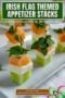 Single-image Celtic-styled poster with three stacked melon and feta appetizers on a rustic board with text banners.