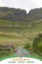 Scenic road winding through Gleniff Valley in County Leitrim, Ireland, surrounded by green hills and dramatic limestone cliffs in the Irish countryside.