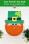 Paper plate leprechaun with read beard and green shamrock hat plus a text banner
