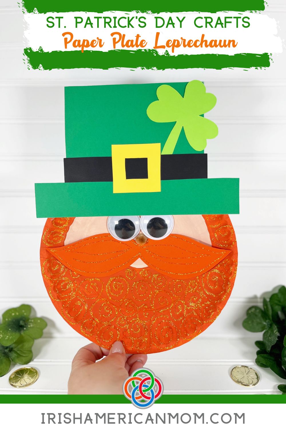 Paper plate leprechaun craft with orange glitter beard, green hat with shamrock, googly eyes, and yellow buckle displayed on a white background for a St. Patrick’s Day kids craft tutorial.