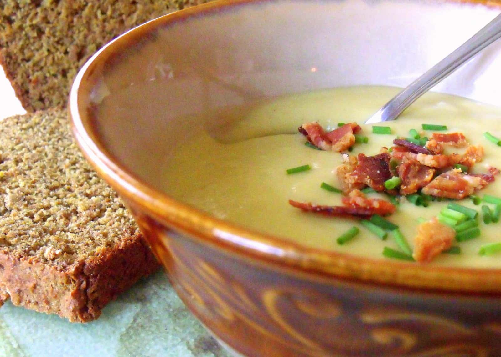 A bowl of creamy potato and leek soup, a classic Irish comfort food recipe.