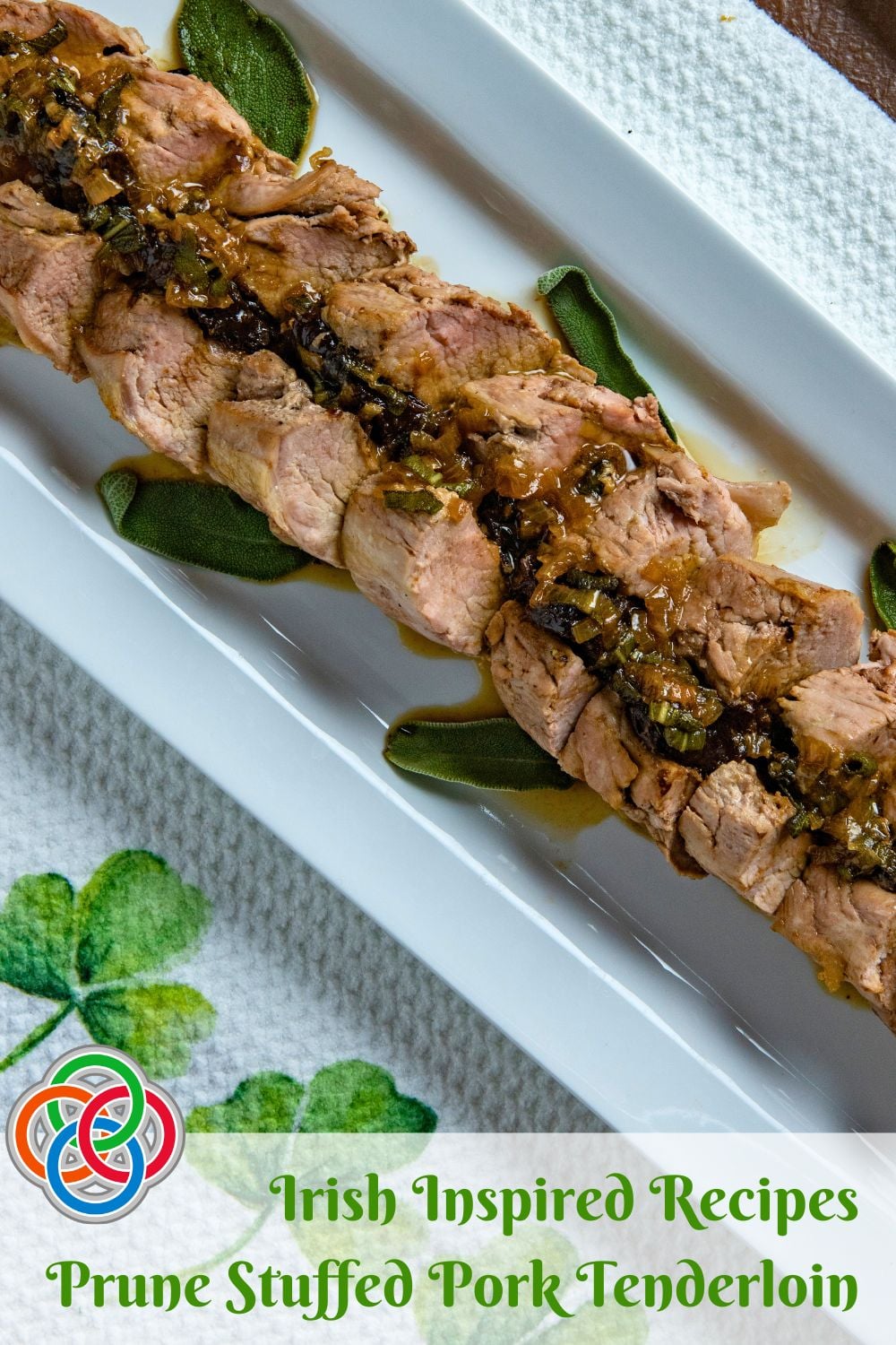Sliced prune stuffed pork tenderloin with gravy on a white platter, labeled Irish inspired recipes prune stuffed pork tenderloin.