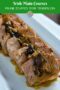 Sliced prune stuffed pork tenderloin topped with gravy on a white platter, labeled Irish main course prune stuffed pork tenderloin.