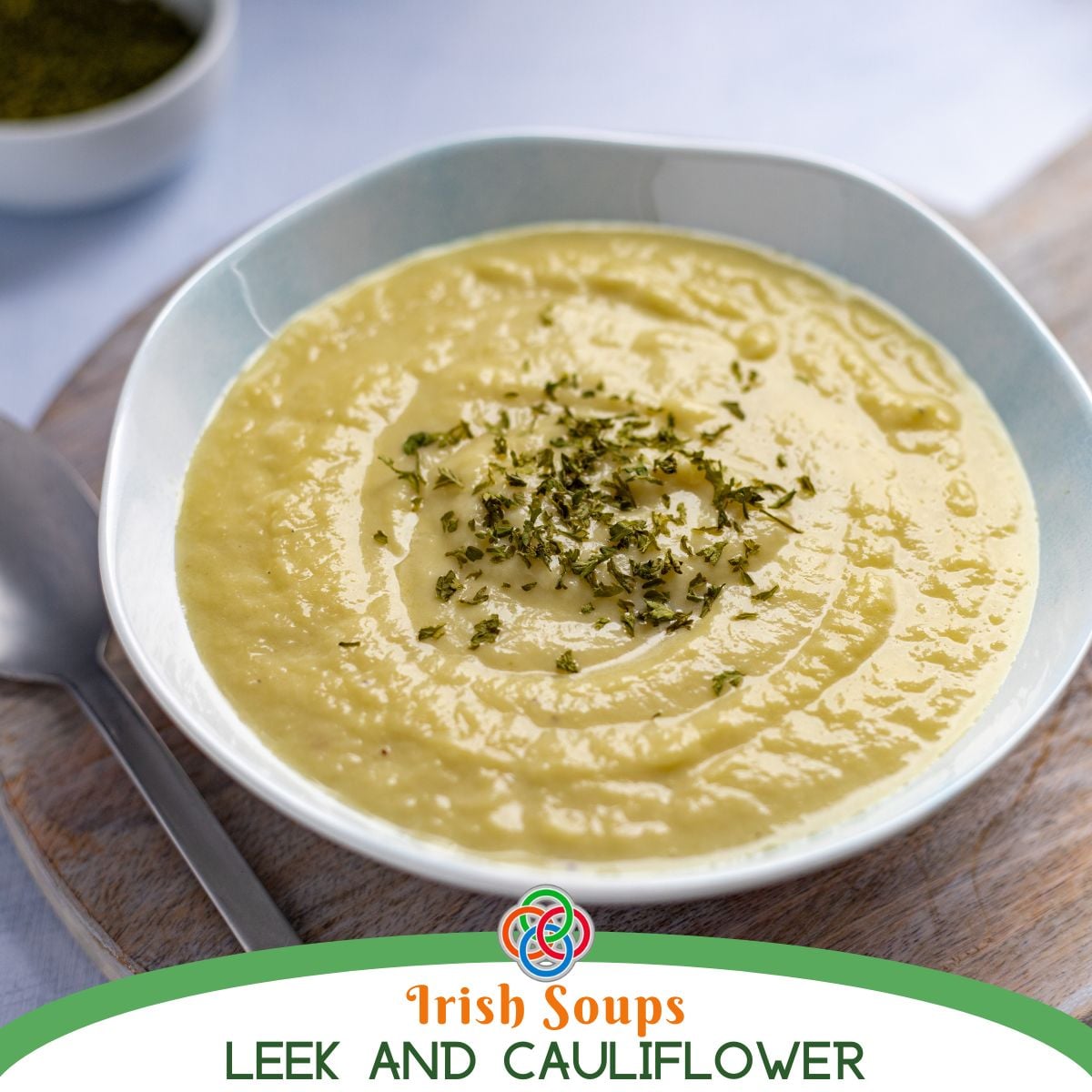 A bowl of creamy cauliflower and leek soup with a smooth texture and mild flavor.