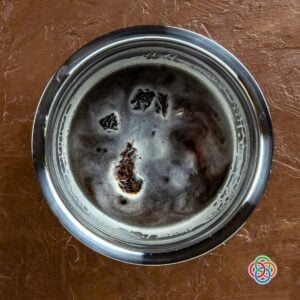 Prunes soaking in ale for prune stuffed pork steak | Irish American Mom Prunes soaking in Irish ale in a bowl, preparing the stuffing for prune stuffed pork tenderloin.