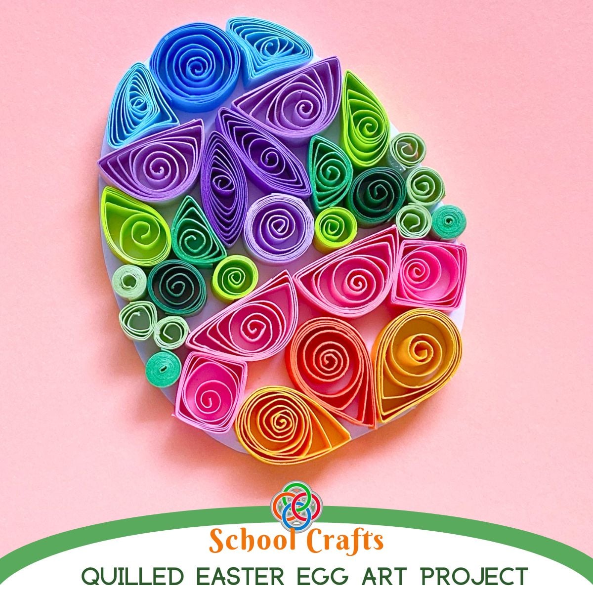 Brightly colored quilled Easter egg made with paper coils and shapes on a pink background with text reading “School Crafts Quilled Easter Egg Art Project.”
