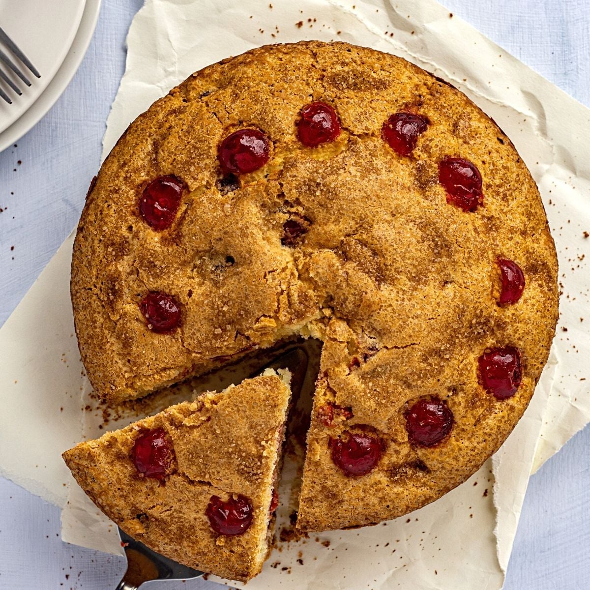 Aerial view of an Irish Cherry Tea Cake with a slice cut 