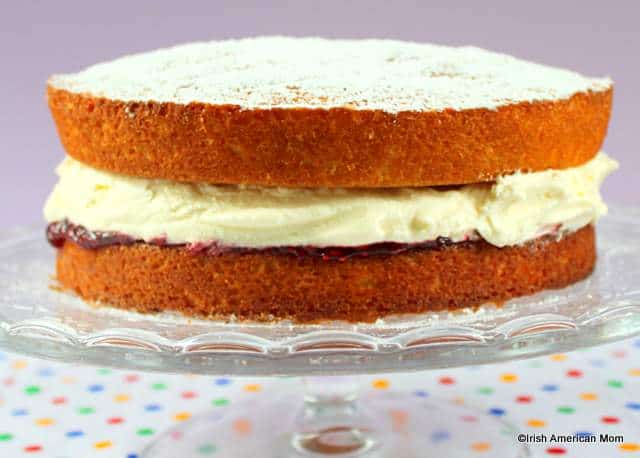 Victoria Sponge Sandwich on a cake stand.