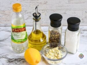 Ingredients for a Gorgonzola Salad Dressing | Irish American Mom Ingredients for homemade Gorgonzola salad dressing including crumbled Gorgonzola cheese, olive oil, white wine vinegar, fresh lemon, salt and black pepper.