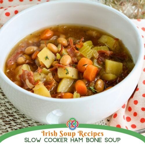 Irish Soup Recipe slow cooker ham bone soup | Irish American Mom Close-up of homemade ham bone and vegetable soup with tender potatoes, carrots, celery, white beans and shredded ham in a savory broth.