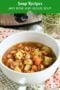 Close-up of homemade ham bone and vegetable soup with tender potatoes, carrots, celery, white beans and shredded ham in a savory broth.