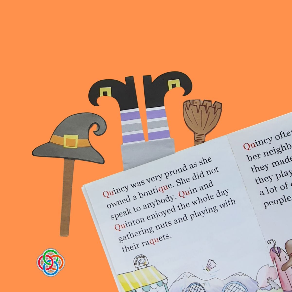 Three Paper Witch Themed Halloween Bookmarks | Irish American Mom Three handmade paper witch bookmarks marking an open childrenโs book, featuring purple striped witch legs with curly black shoes, a gray pointy witch hat, and a brown broomstick on an orange background.