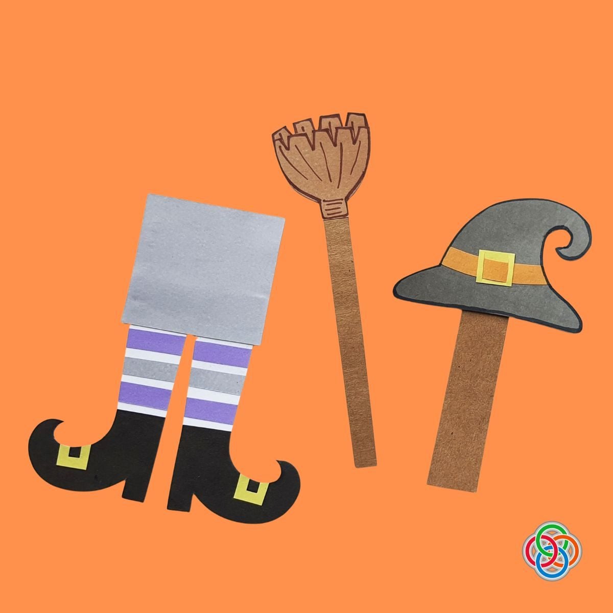Witch Broom hat and striped legs Halloween Bookmarks | Irish American Mom Three handmade paper Halloween bookmarks on an orange background featuring purple striped witch legs with curled black shoes, a brown witch broomstick, and a gray pointy witch hat with an orange band and yellow buckle.