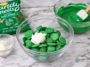 Green candy melts in a microwave safe bowl | Irish American Mom